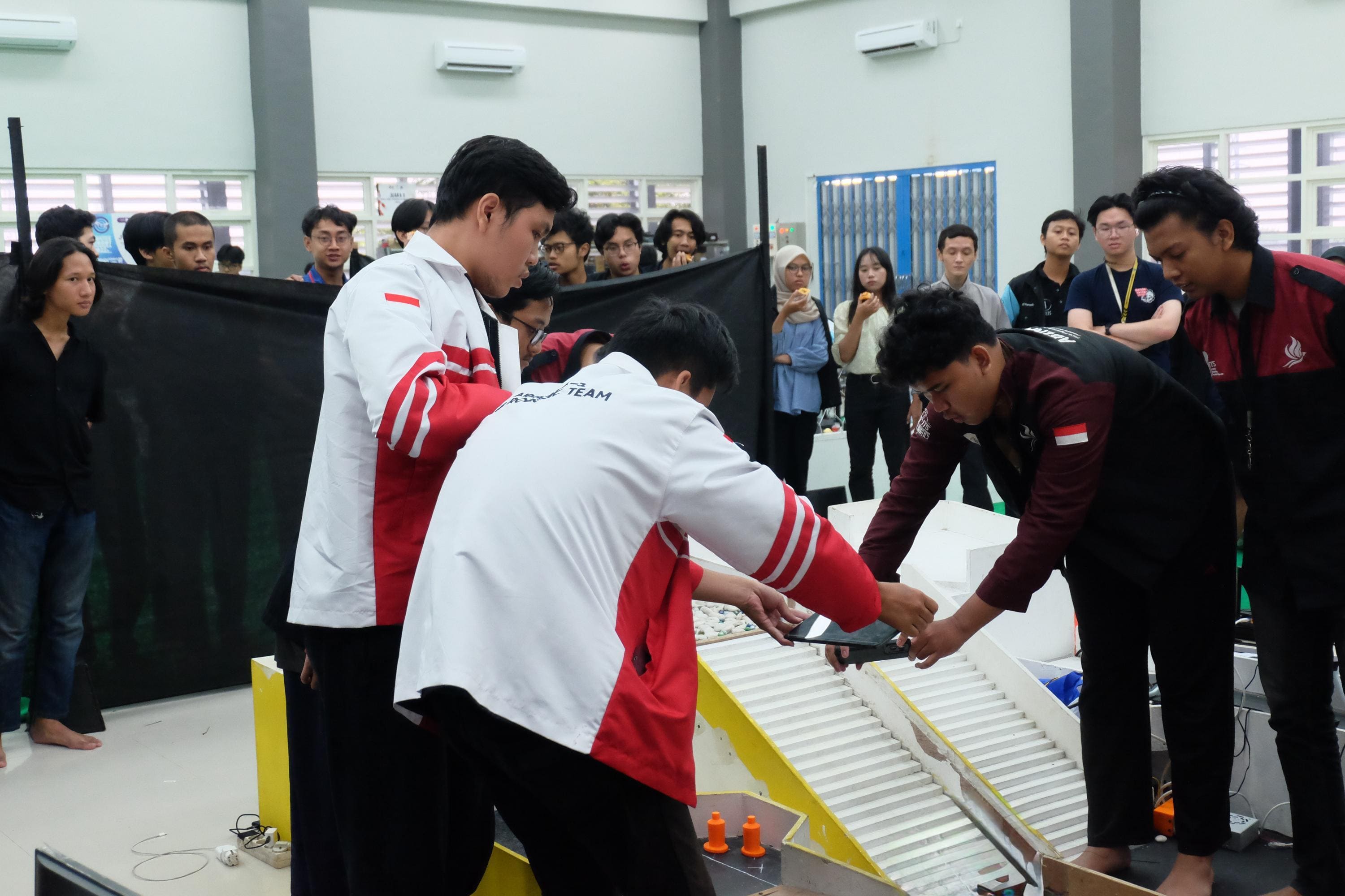 Abinara team preparing a robot during competition
